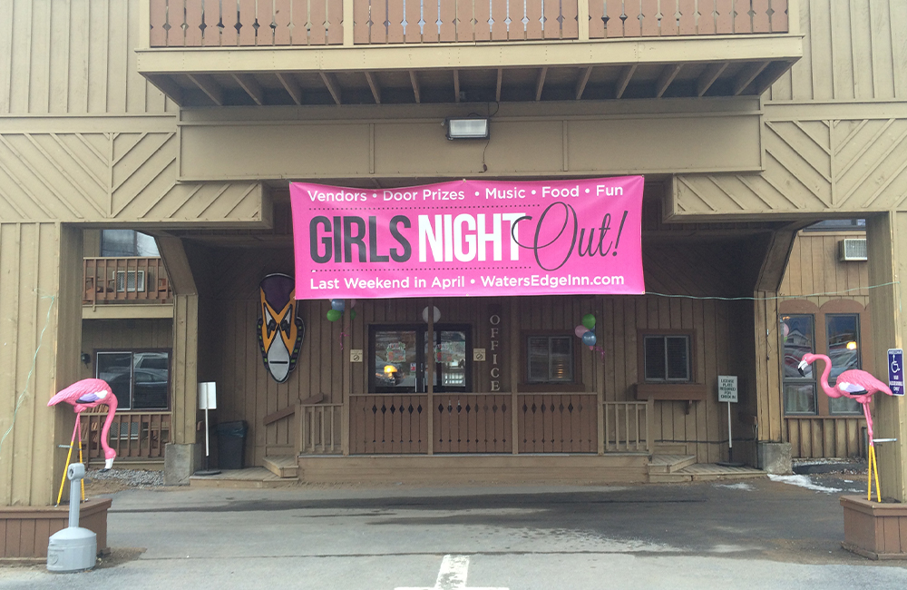 Big sign saying girls night out on the outside of a building