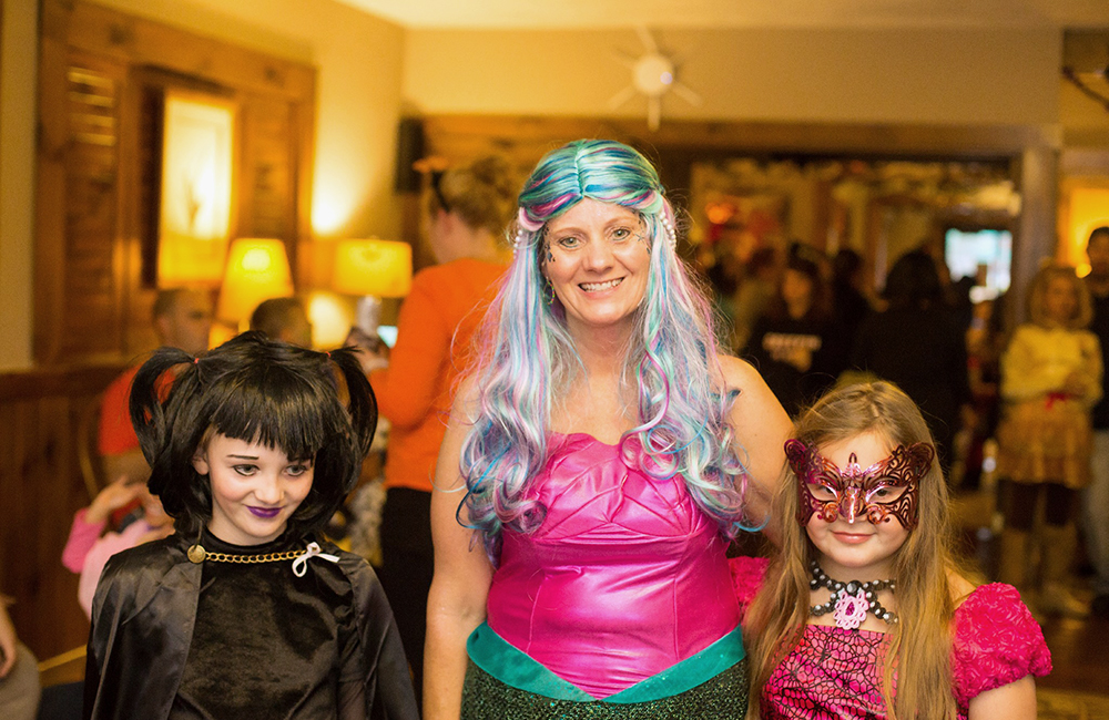 A mom and her girls dressed up for halloween